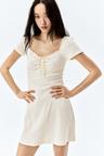 lace-trimmed dress with flared skirt