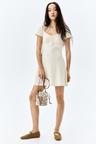 lace-trimmed dress with flared skirt