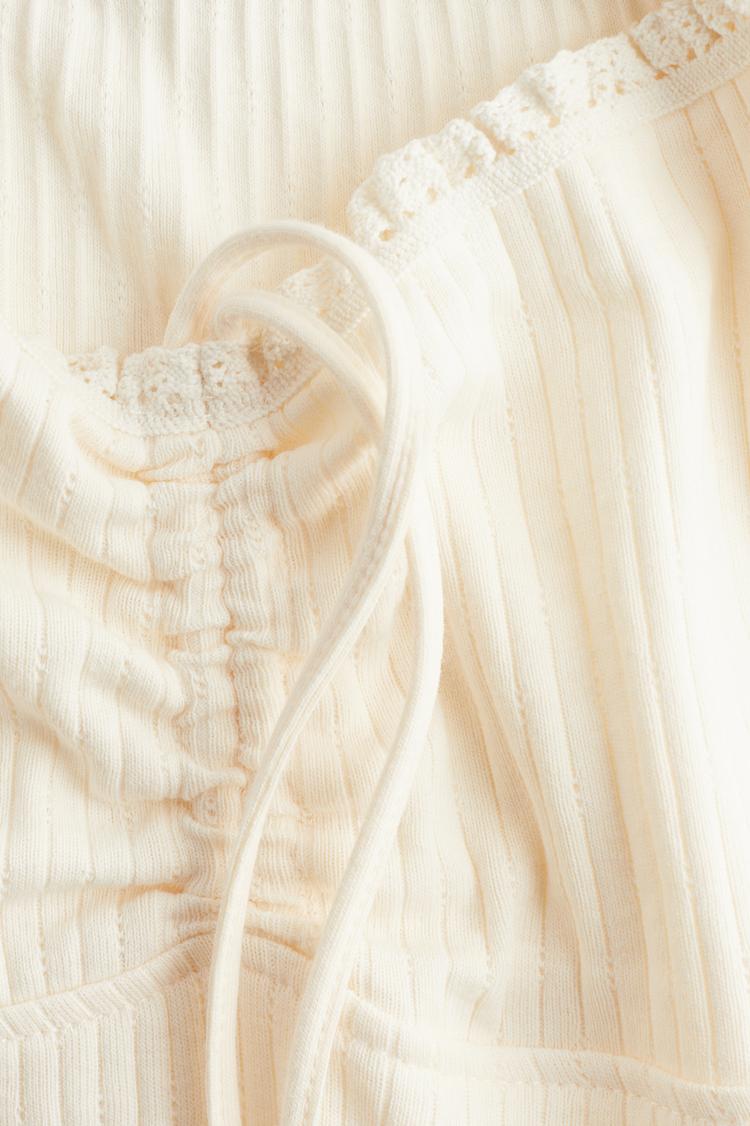 lace-trimmed dress with flared skirt