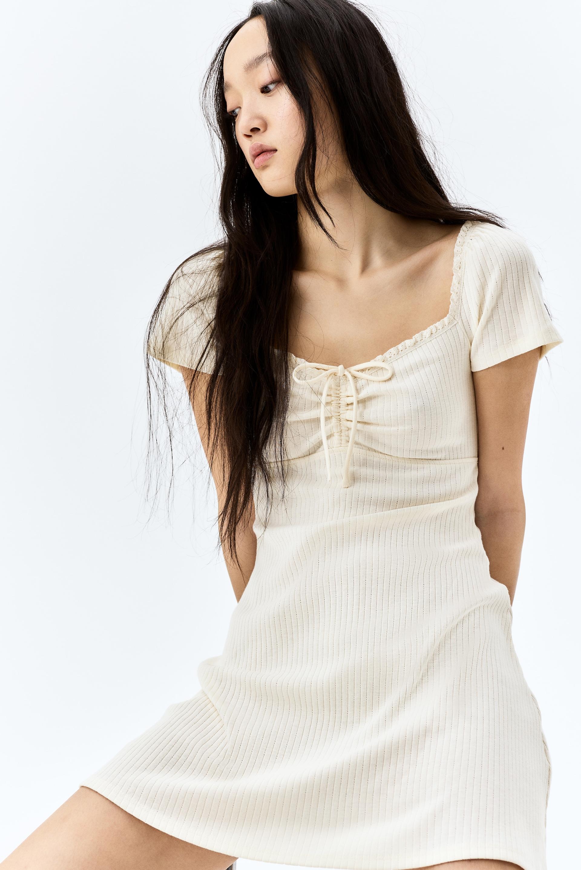 lace-trimmed dress with flared skirt