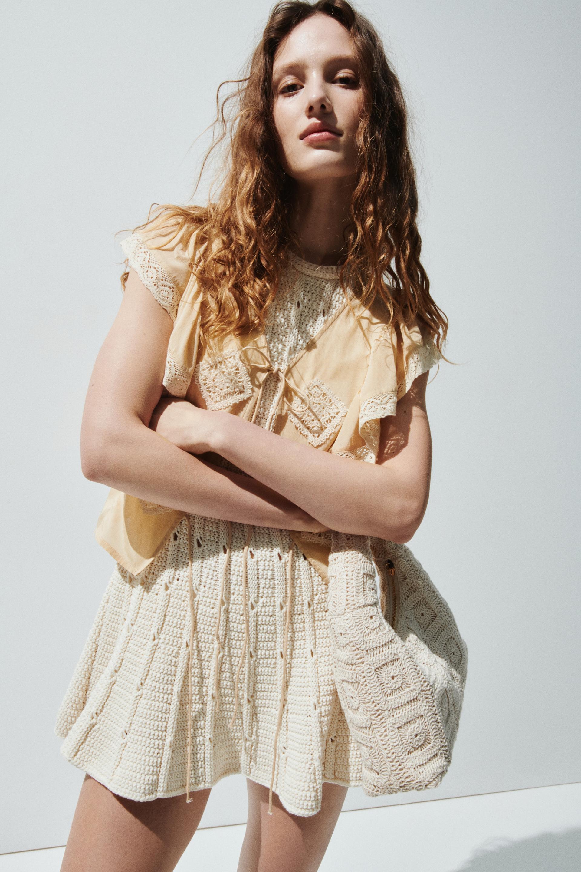 lace-trimmed flounced blouse