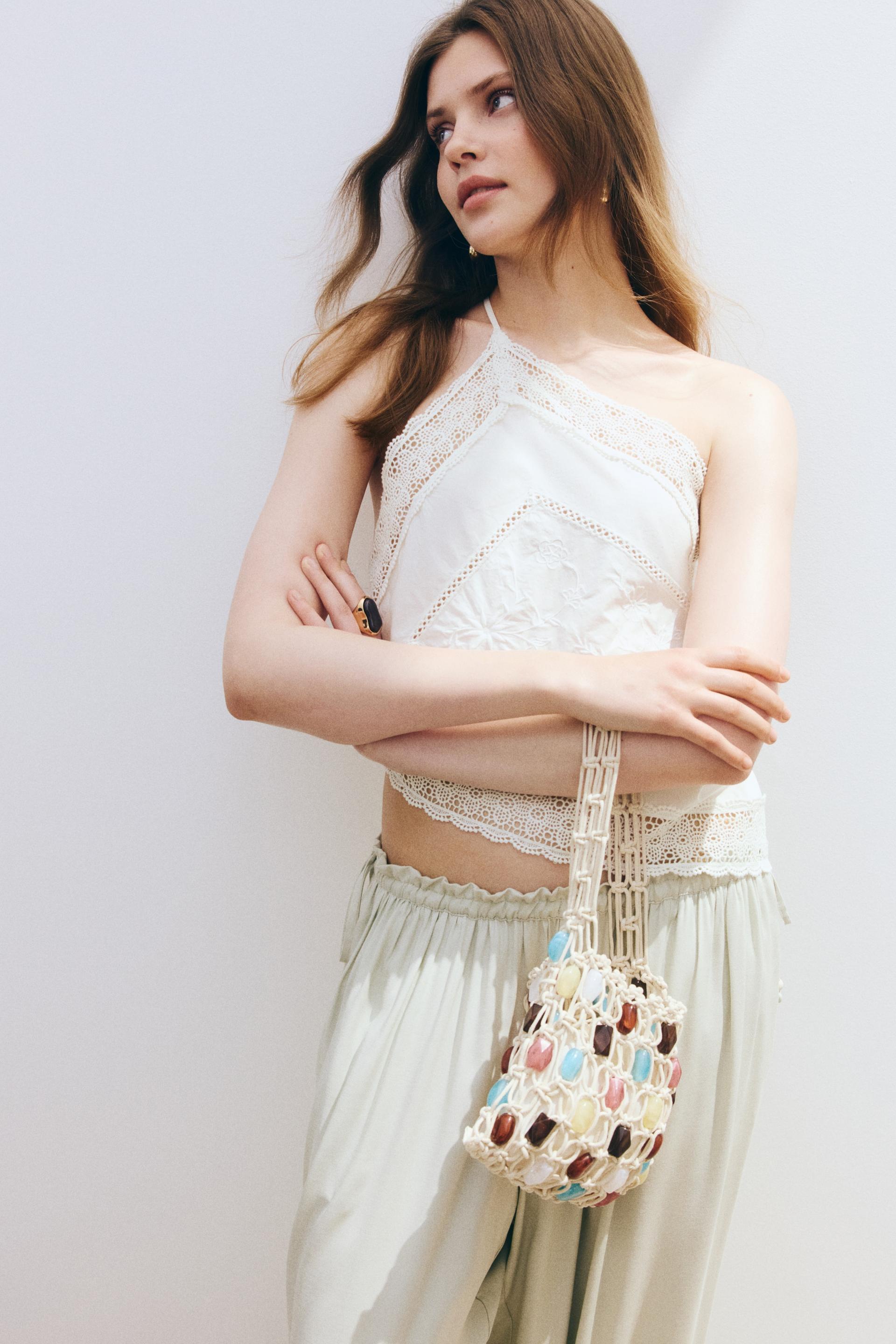 lace-trimmed one-shoulder top