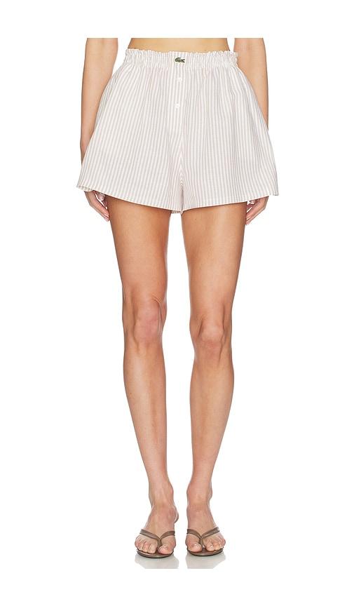 lacoste oversized fit toile shorts in beige.