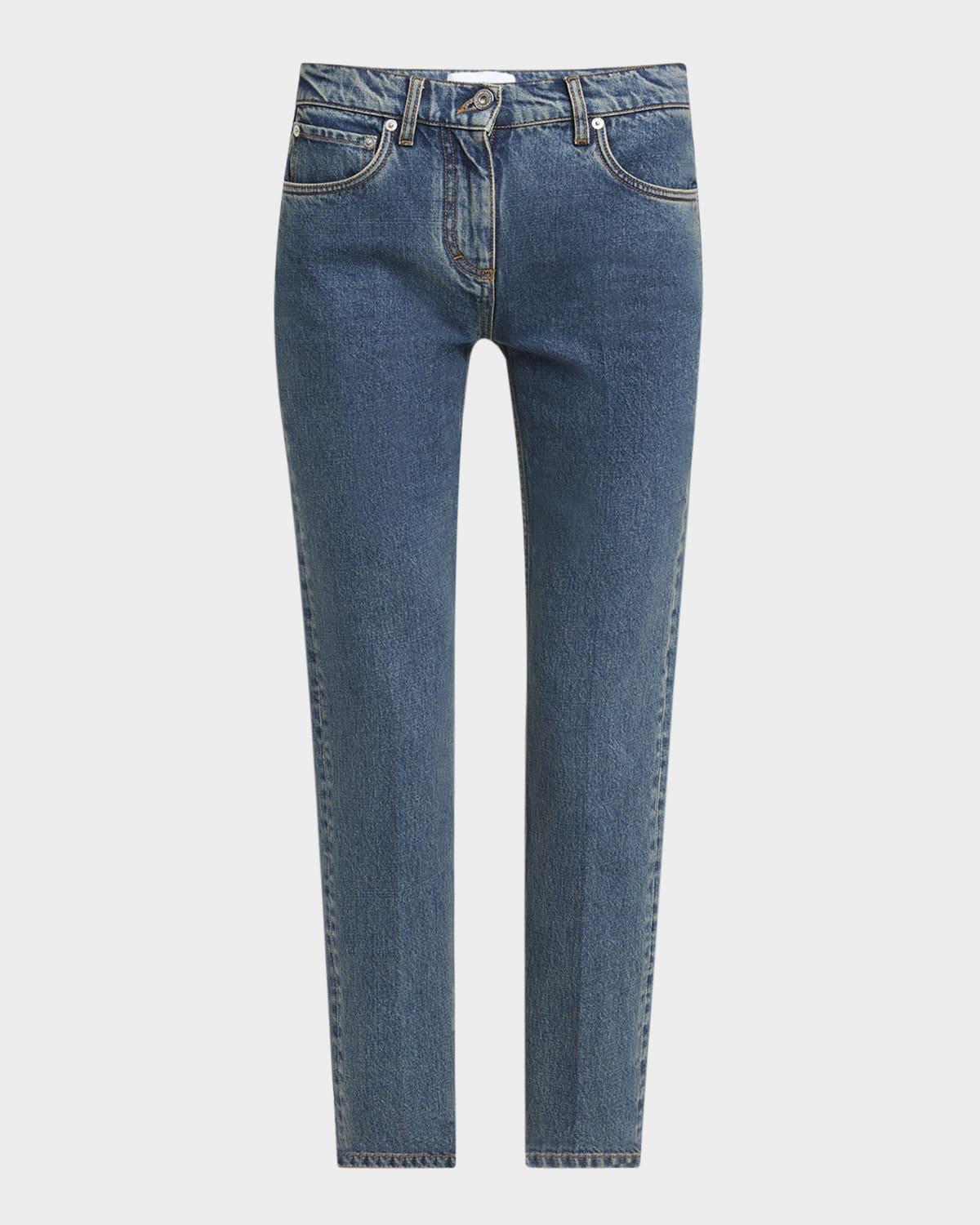laser stone washed denim slim-leg ankle jeans
