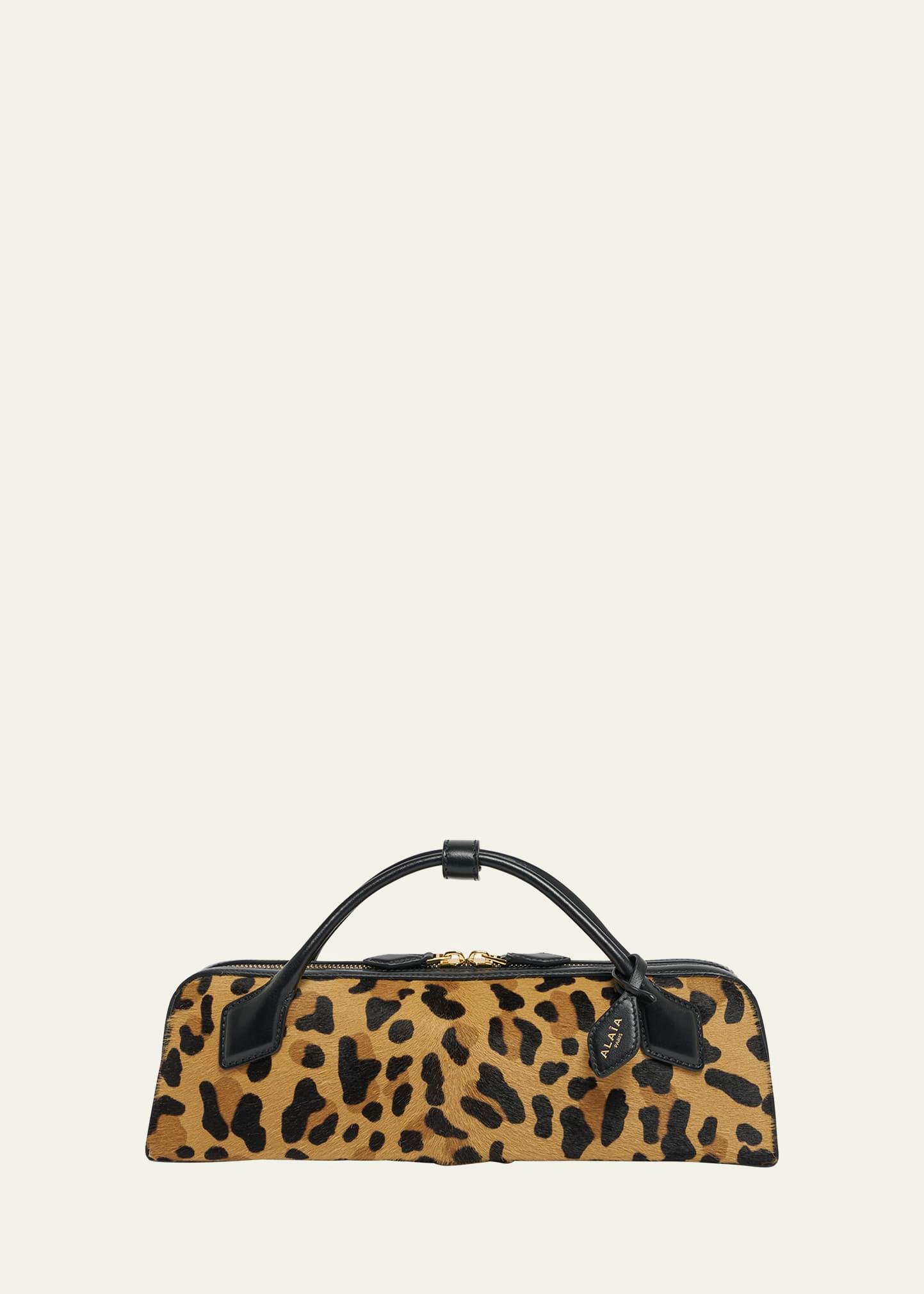 le teckel clutch bag in leopard calf hair