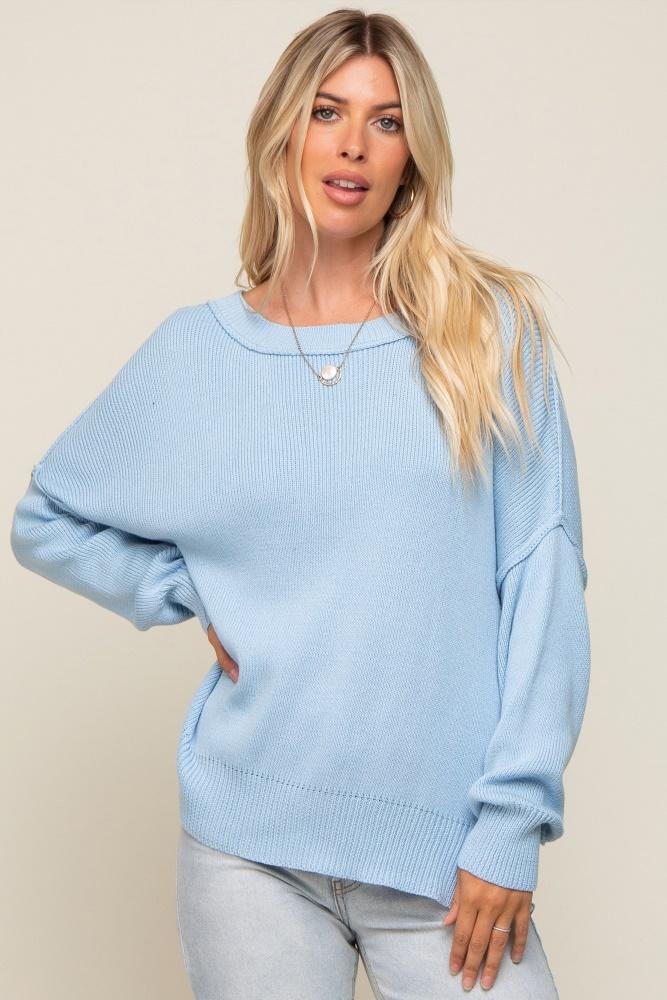 light blue exposed seam side slit sweater