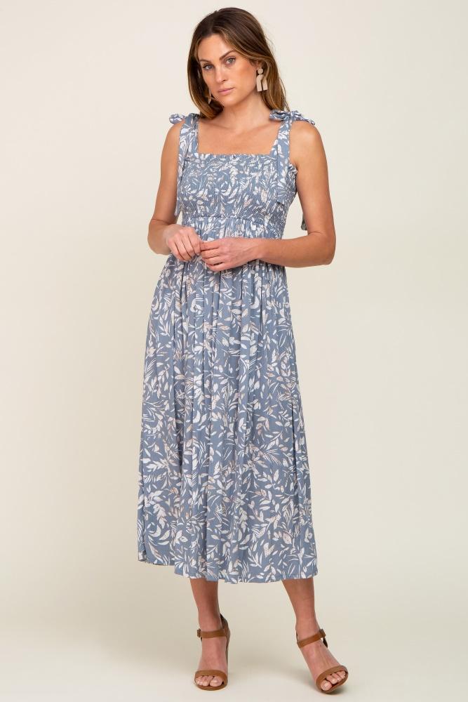light blue floral smocked shoulder tie midi dress