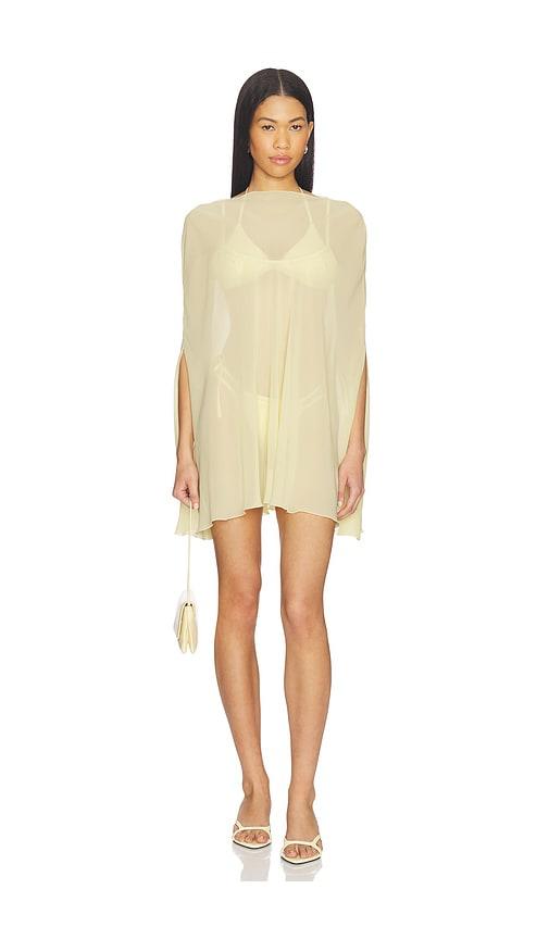 lioness aura poncho in yellow.