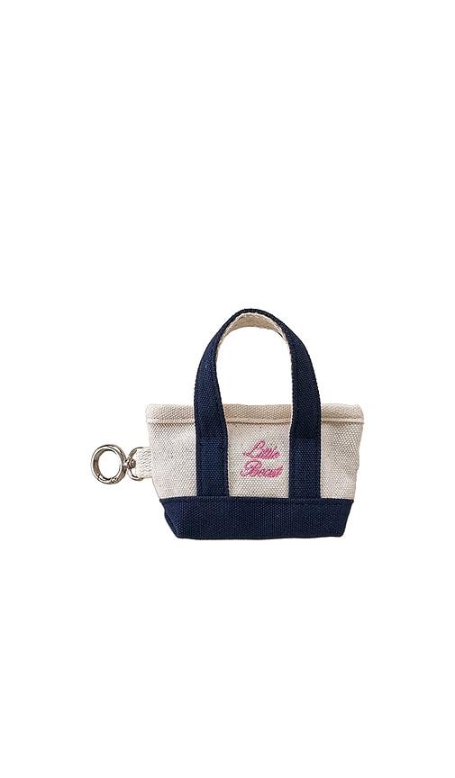 little beast the little beast poop bag tote in cream.