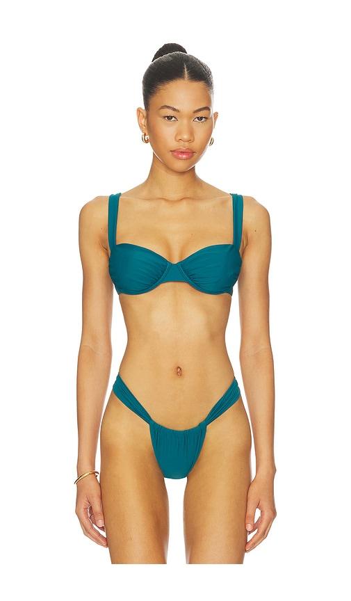 lovers and friends chasing sunsets top in teal.