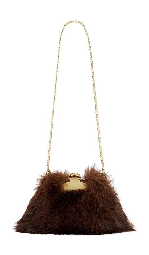 marc jacobs the small claw clip clutch in brown.