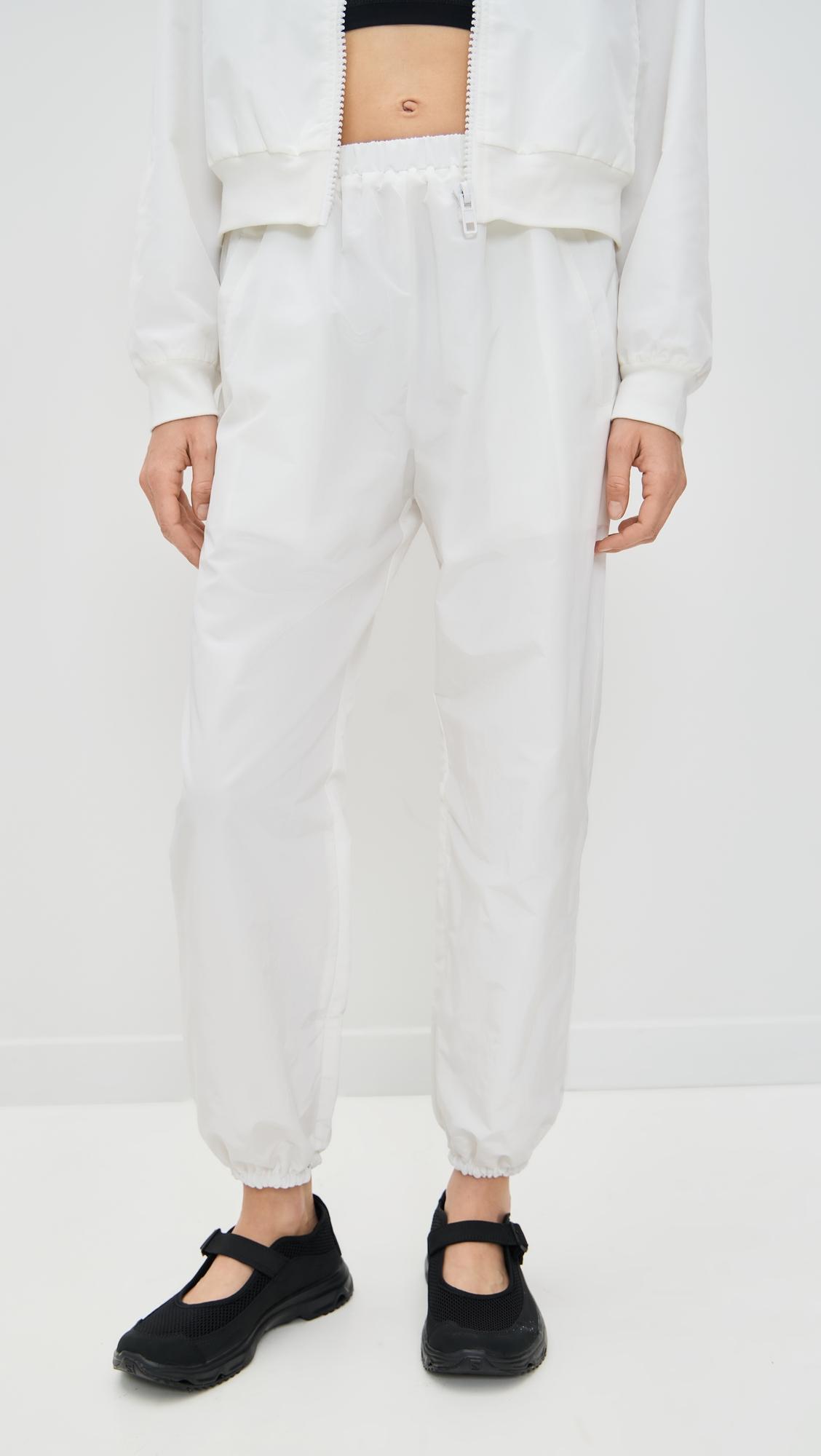 martina optic white tennis warm-up pants with ankle side zippers