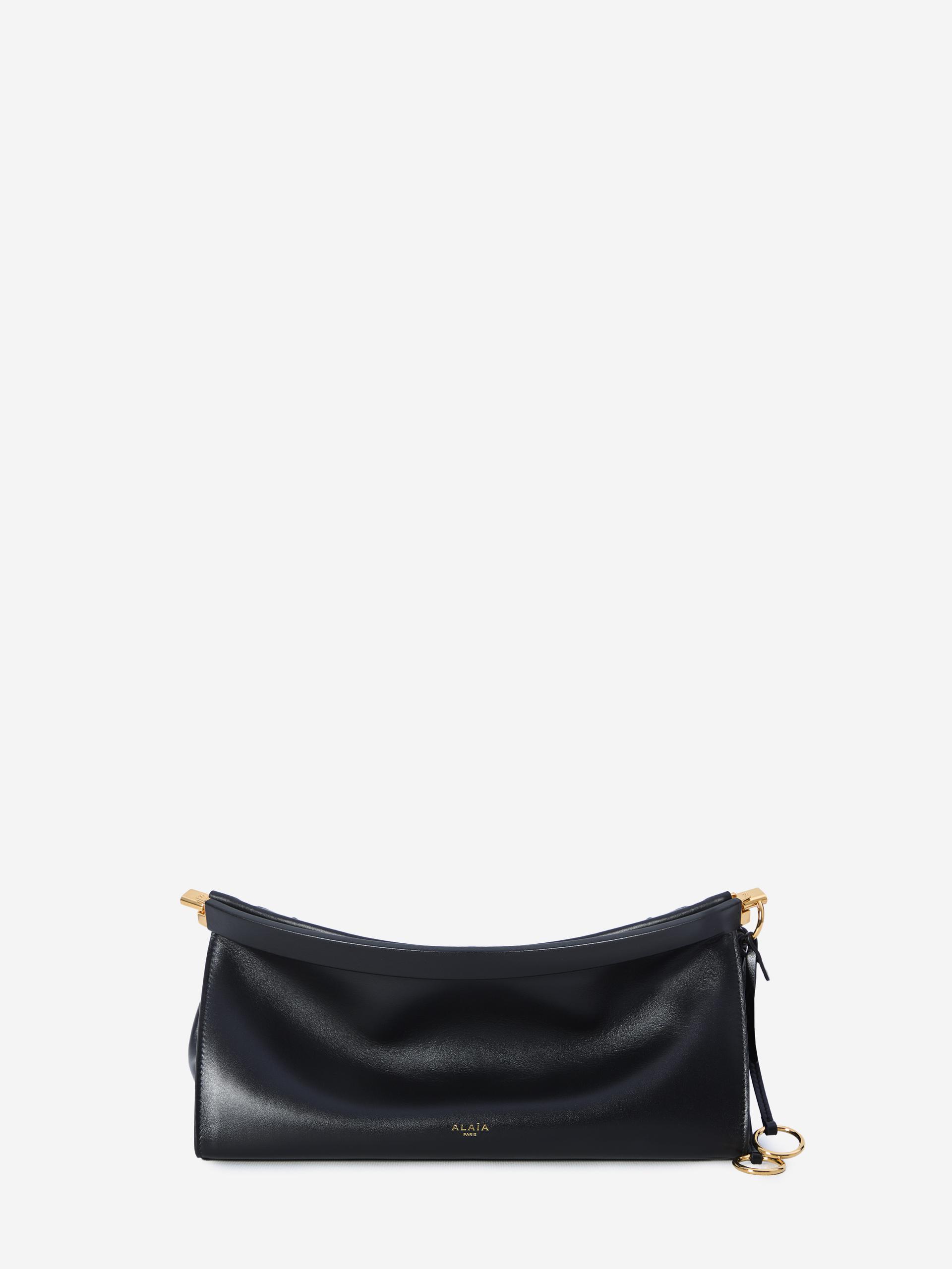 medium le click east west black bag