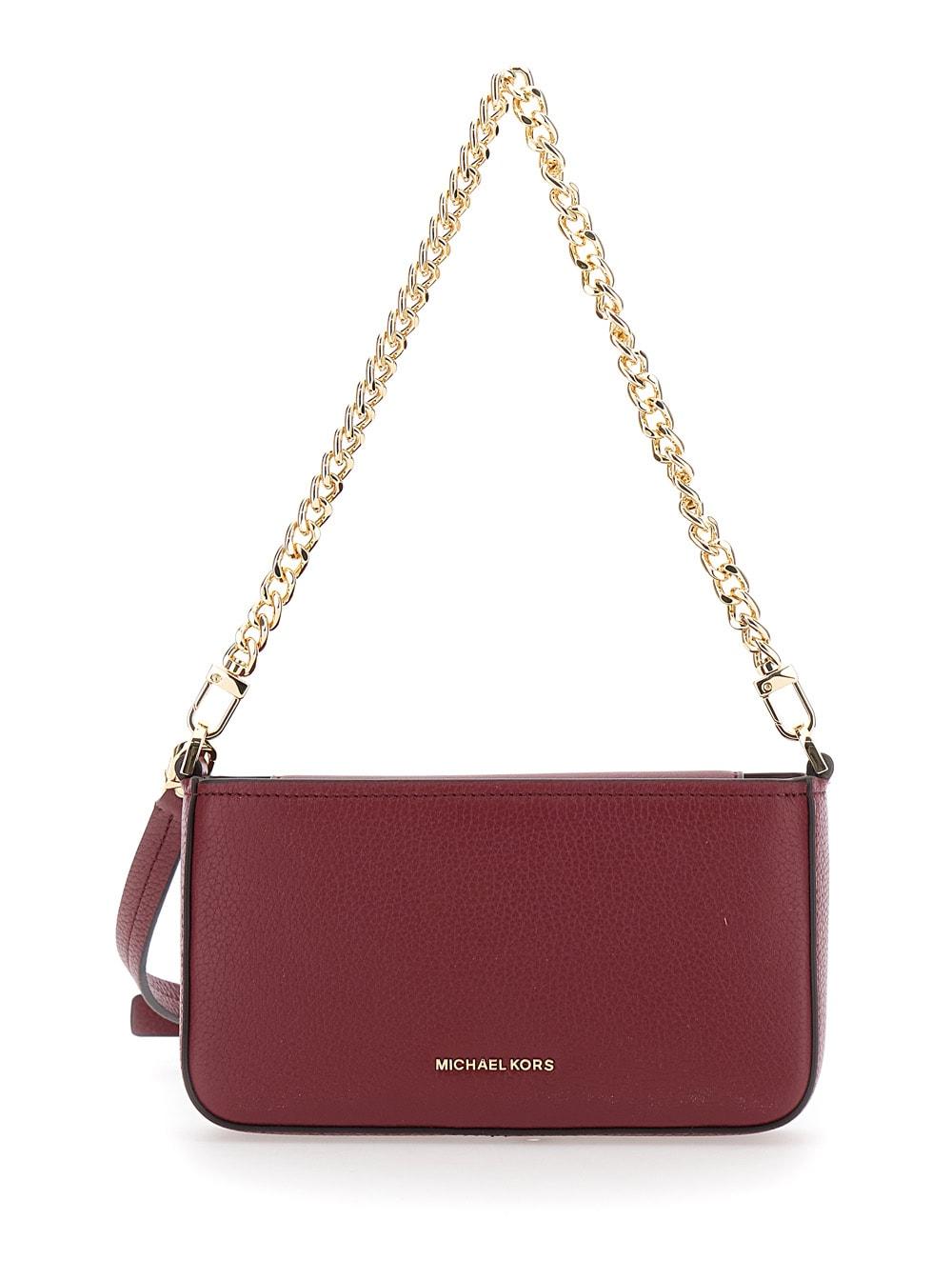 michael kors bryant bordeaux crossbody bag with adjustable shoulder strap and logo lettering on the front in grained leather woman
