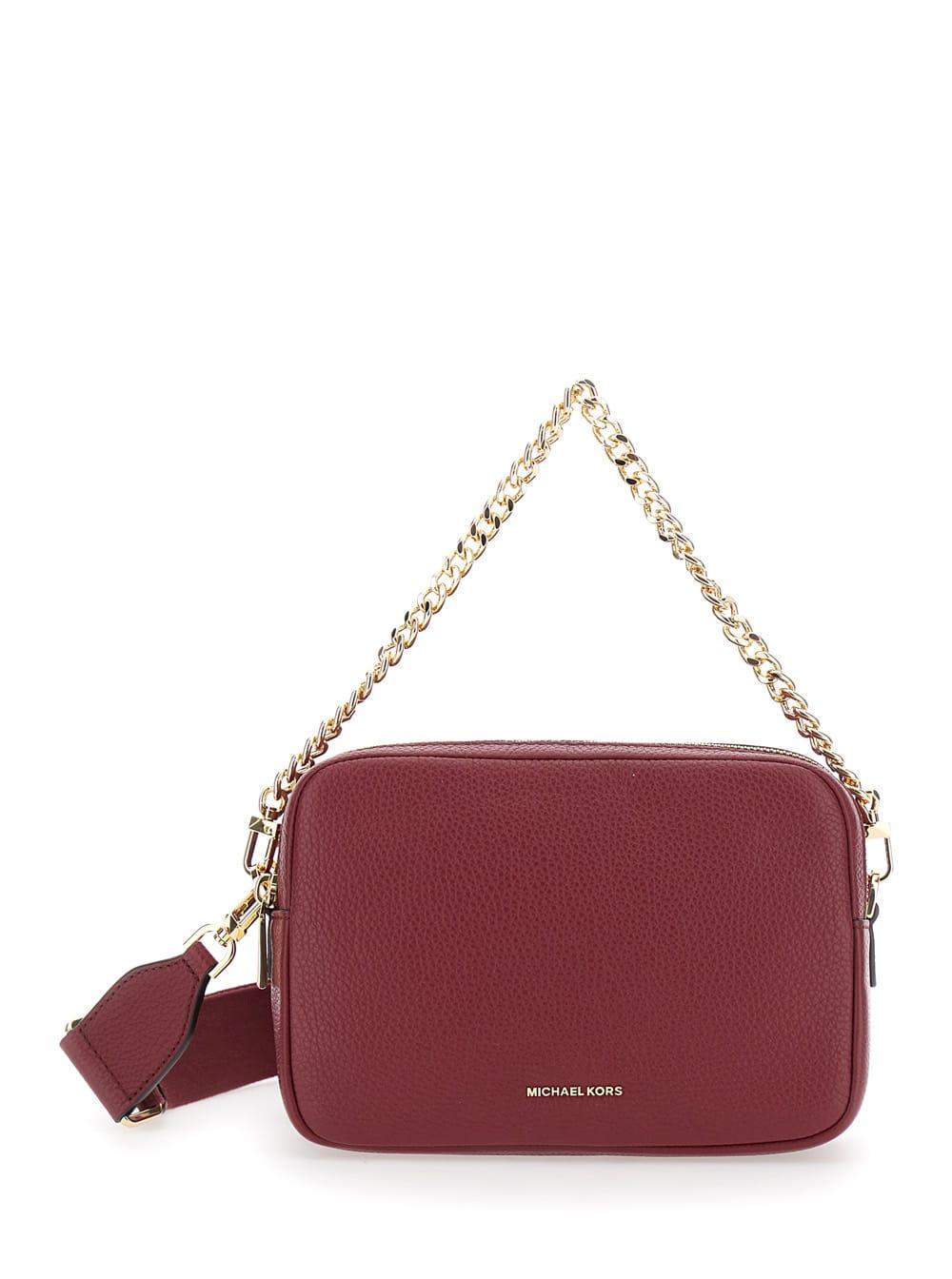 michael kors bryant bordeaux crossbody bag with adjustable shoulder strap and logo lettering on the front in grained leather woman