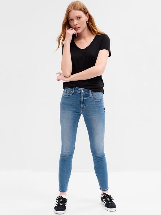 mid rise destructed universal skinny jeans