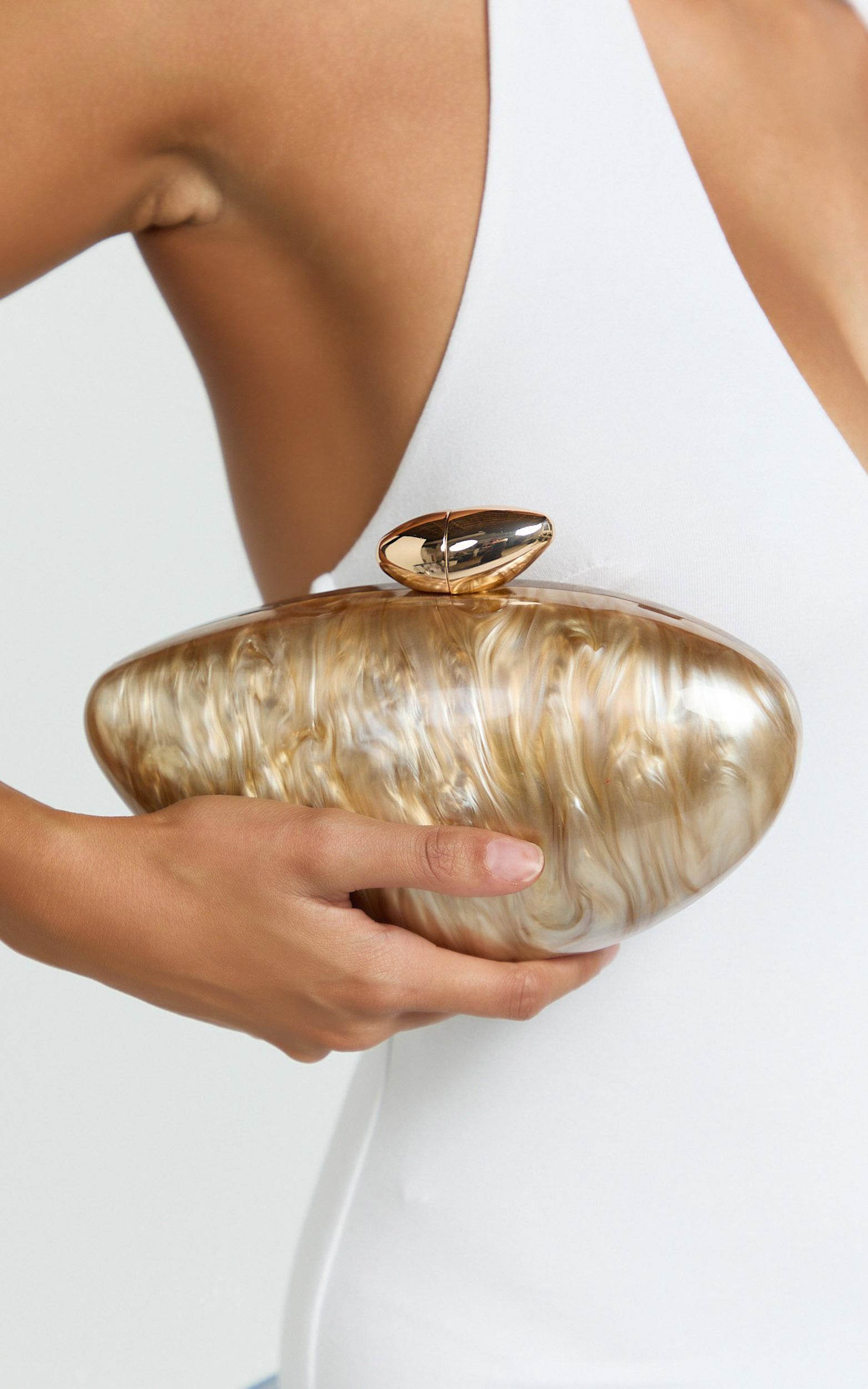 nami clutch bag with hardware detail in beige