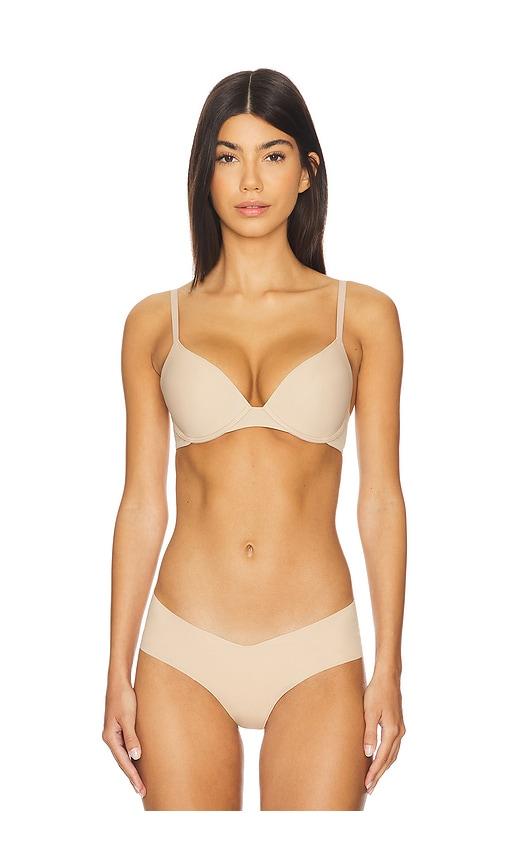 natori minimal convertible push up bra in beige.