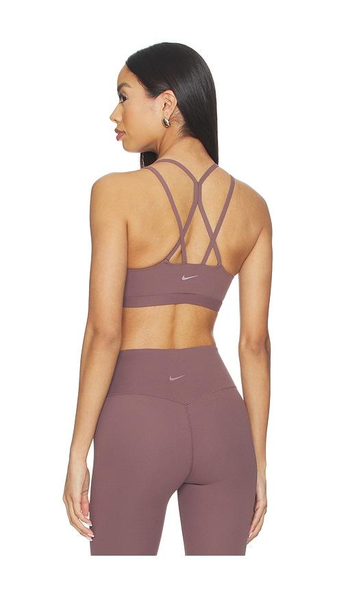 nike light support padded sports bra in mauve.