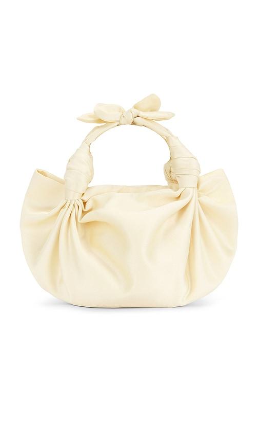 nla collection knot bag in cream.