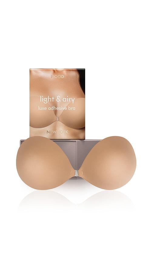 nood light and airy luxe adhesive bra in nude.