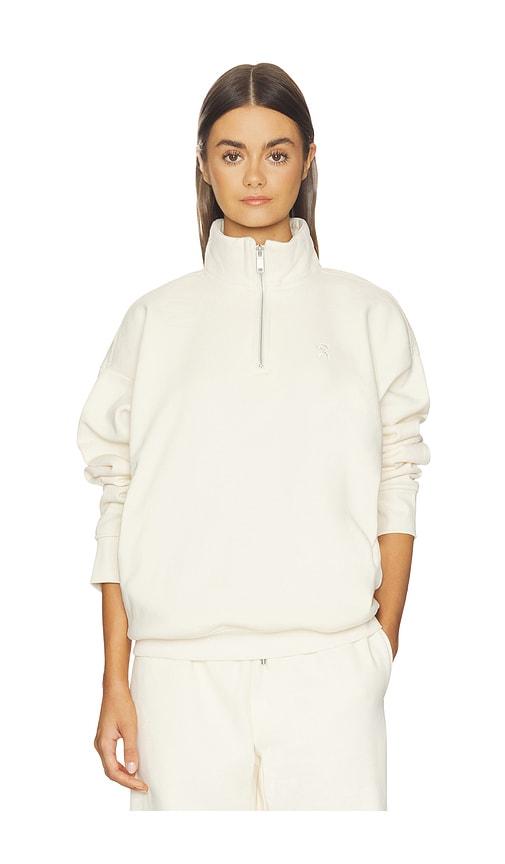 on club collective 1/4 zip sweater in beige.