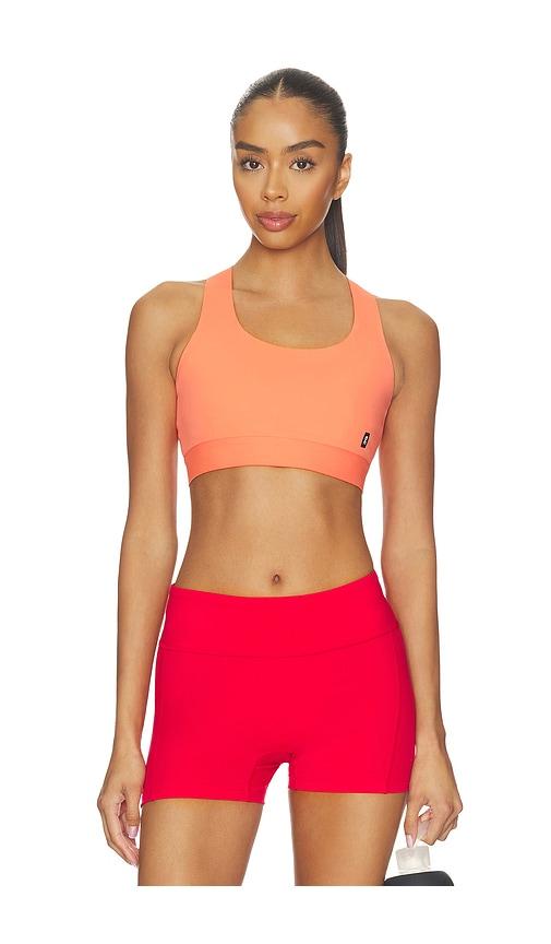 on core bra in coral.