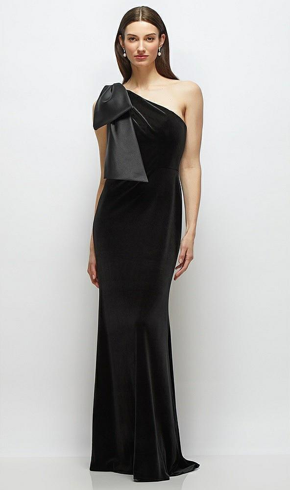 one-shoulder black velvet maxi dress with large trailing satin bow