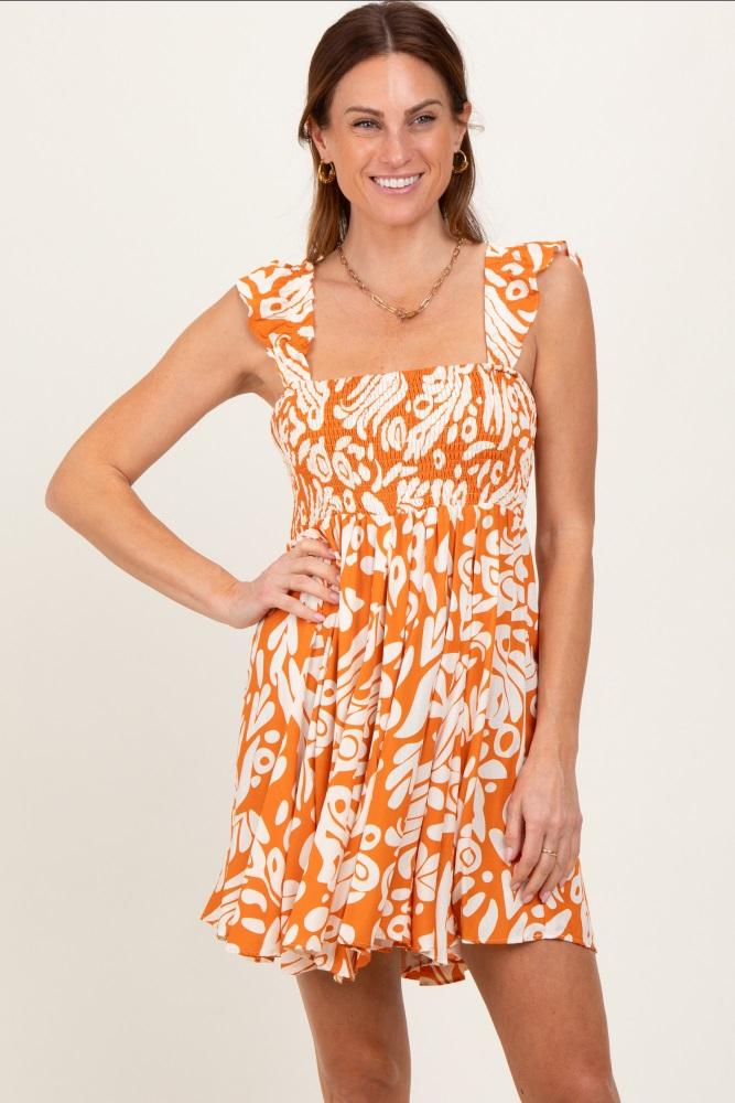 orange printed smocked ruffle strap dress
