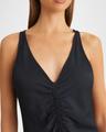 pari sleeveless ruched midi dress