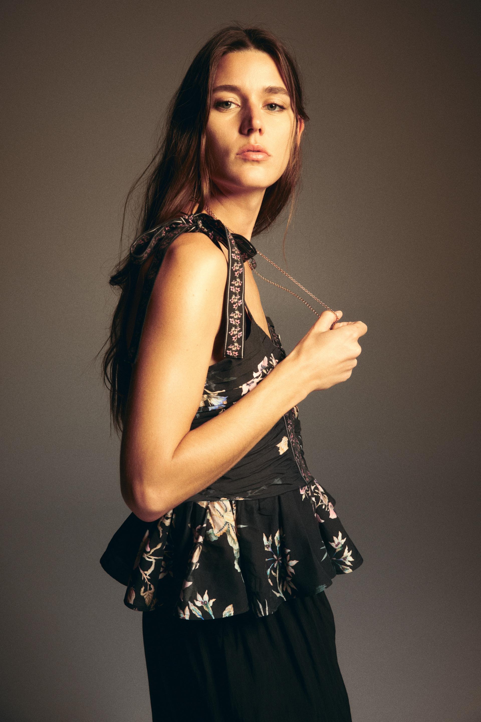 peplum top with tie-top shoulder straps