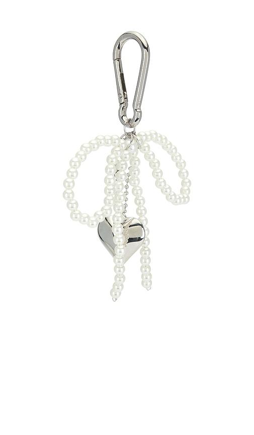 petit moments lolita keychain in metallic silver.