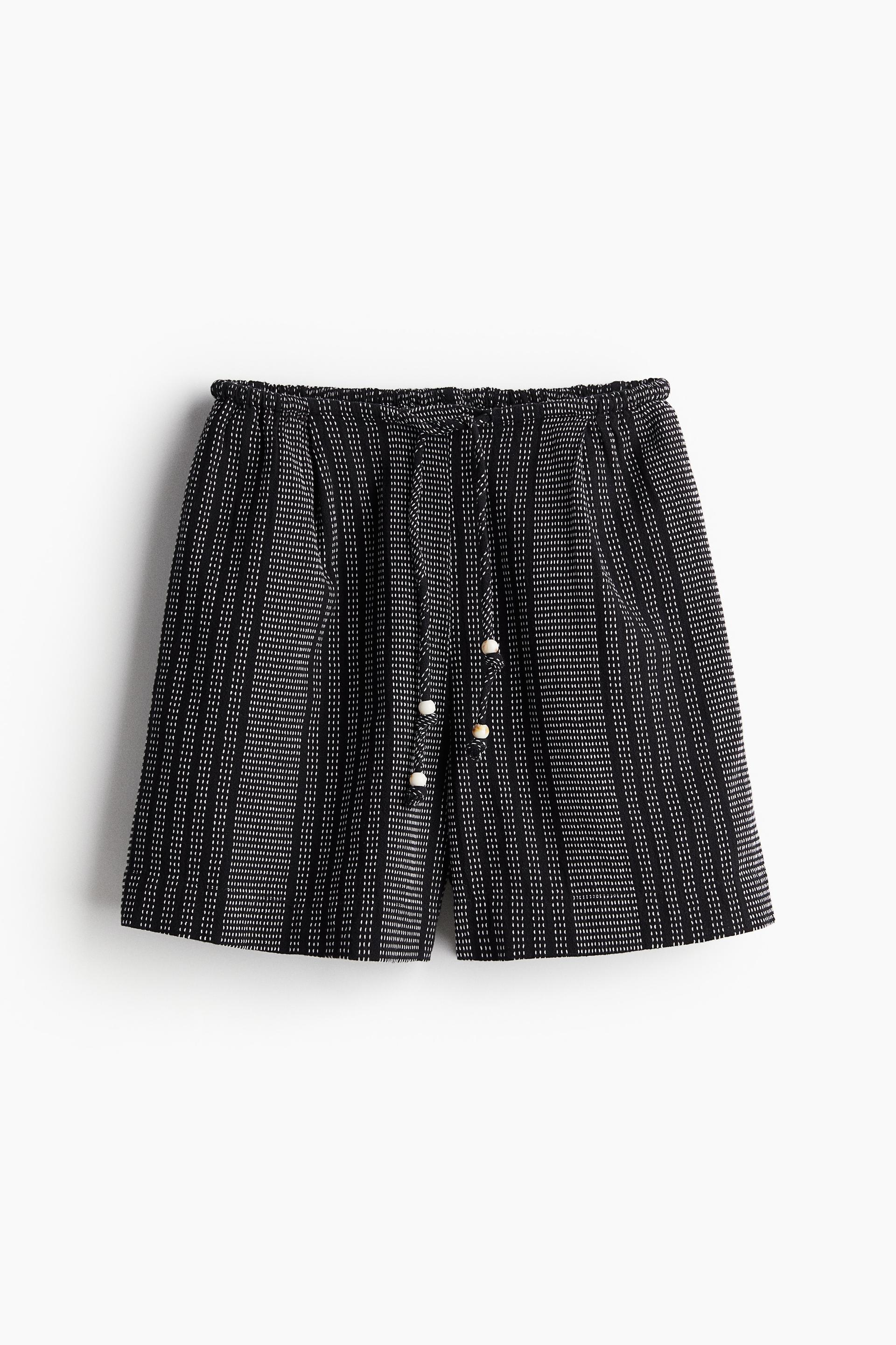 pleat-front shorts