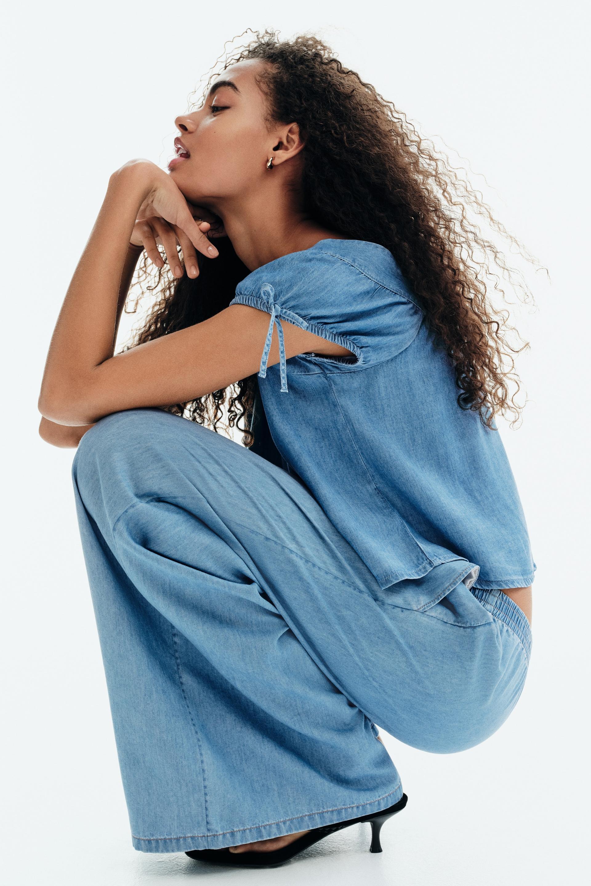 puff-sleeved denim blouse