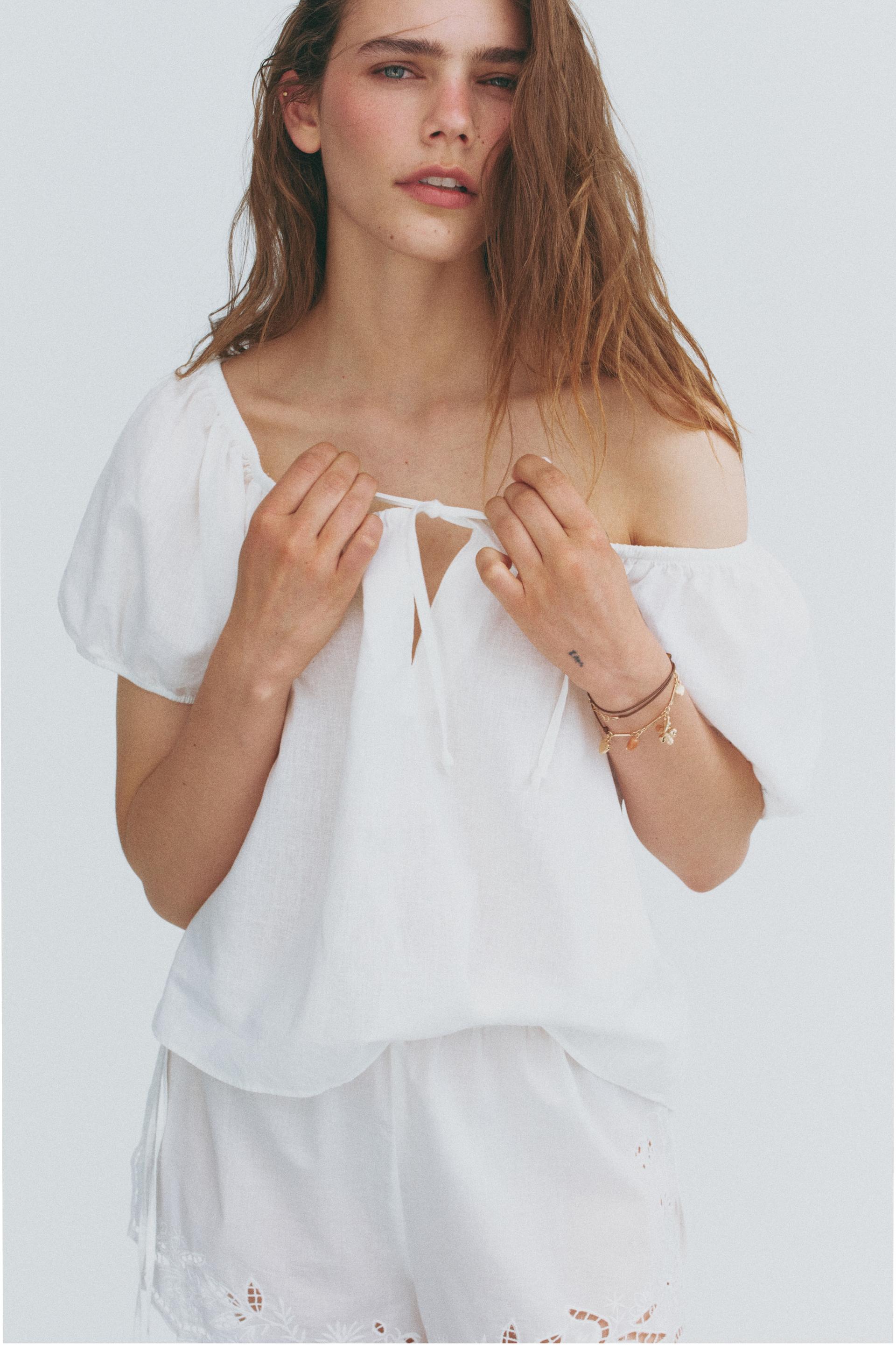 puff-sleeved linen-blend blouse