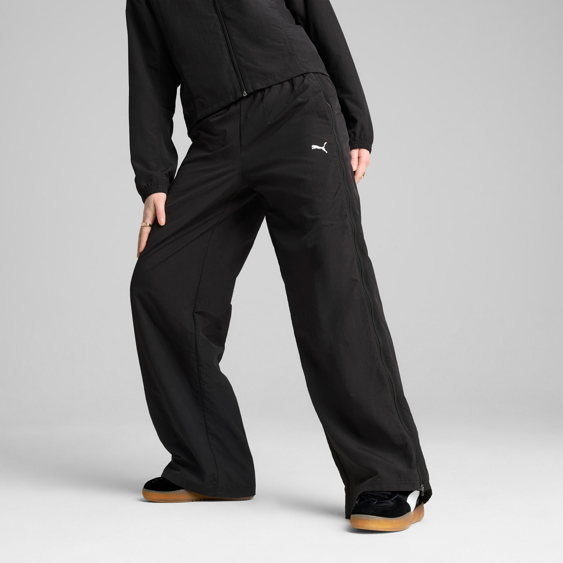 puma dare to women's relaxed woven zip-off pants in black, size s