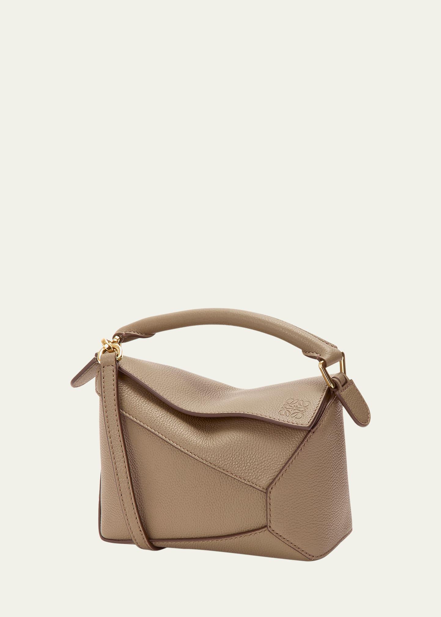 puzzle edge mini top-handle bag in grain leather
