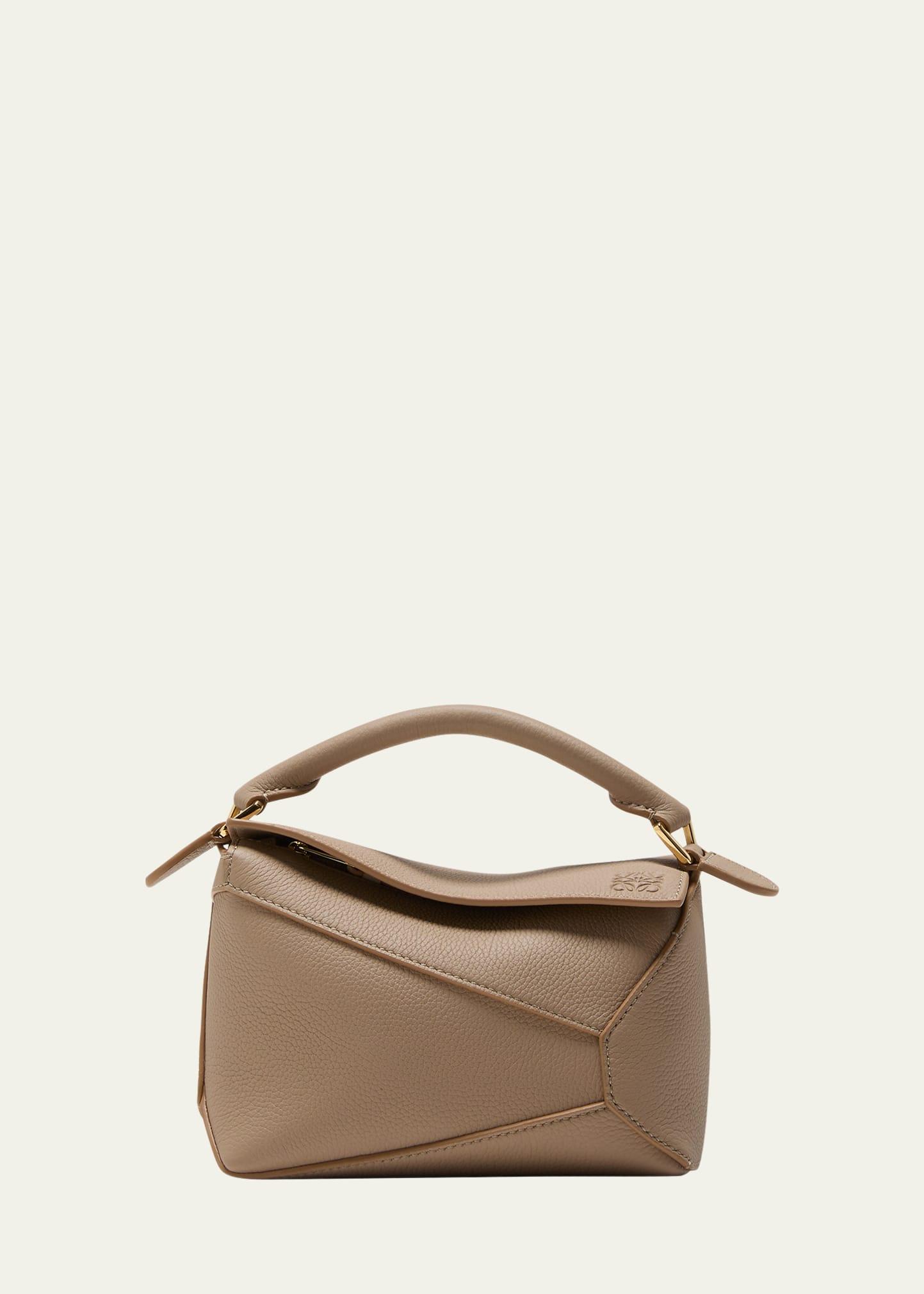 puzzle edge mini top-handle bag in grained leather