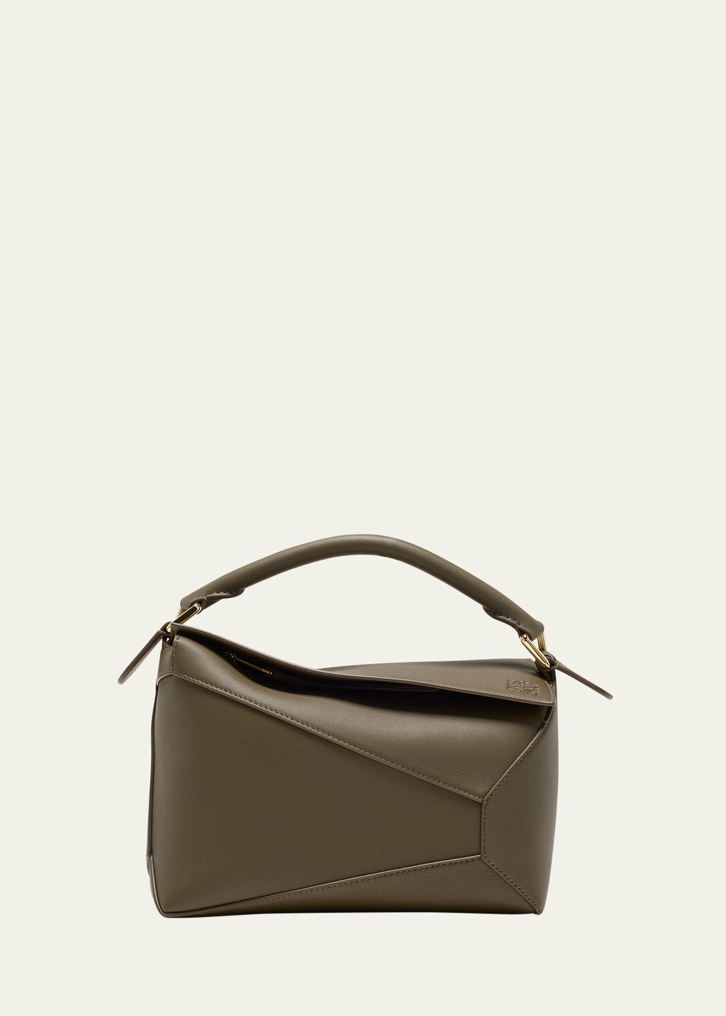 puzzle edge small top-handle bag in leather