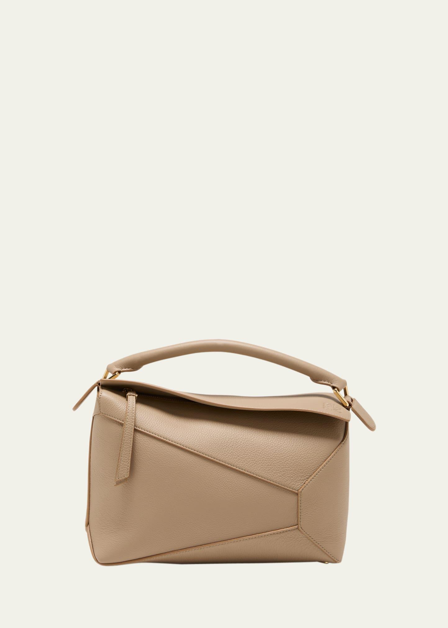 puzzle edge top-handle bag in soft grained leather
