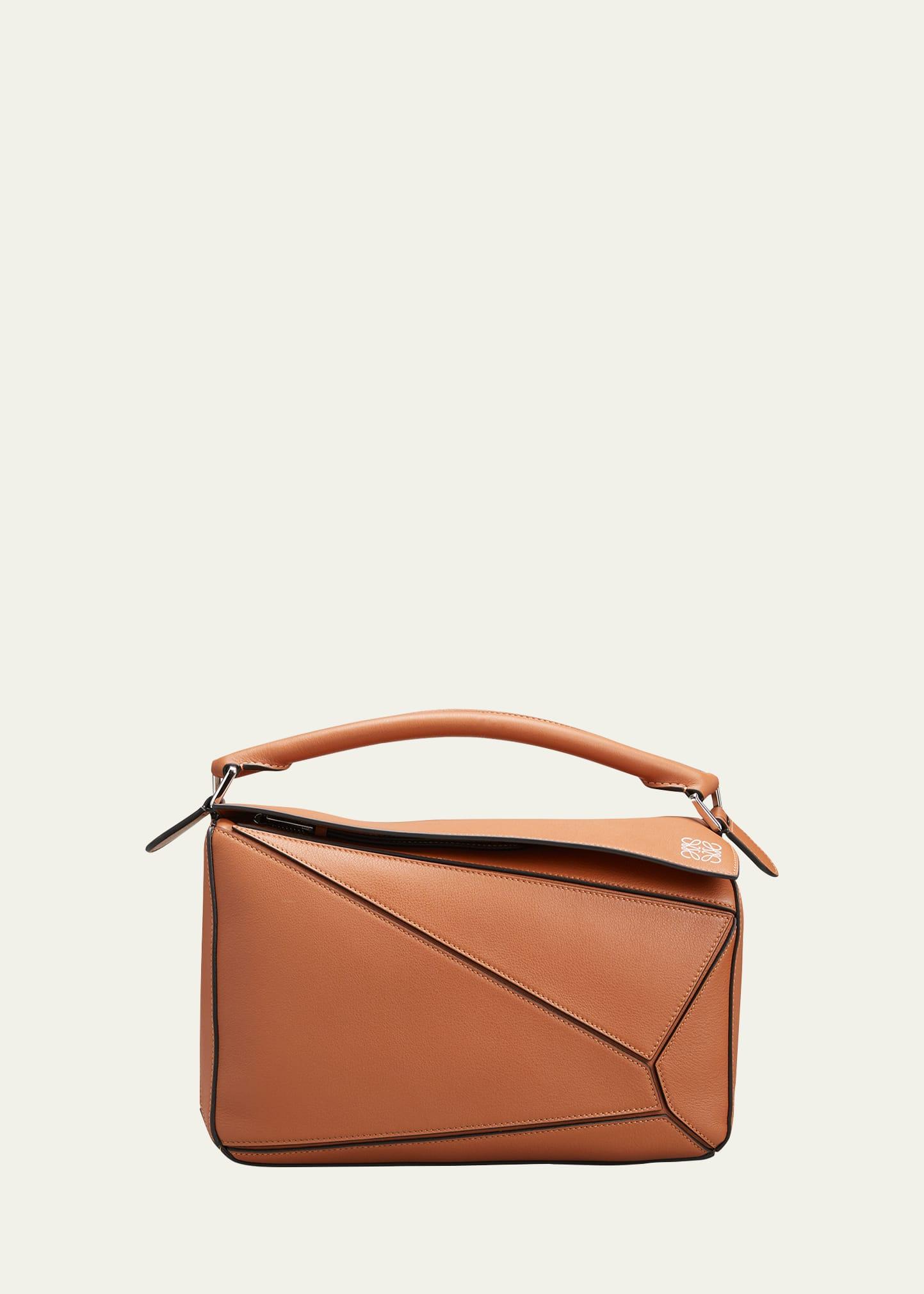 puzzle medium top-handle bag in leather