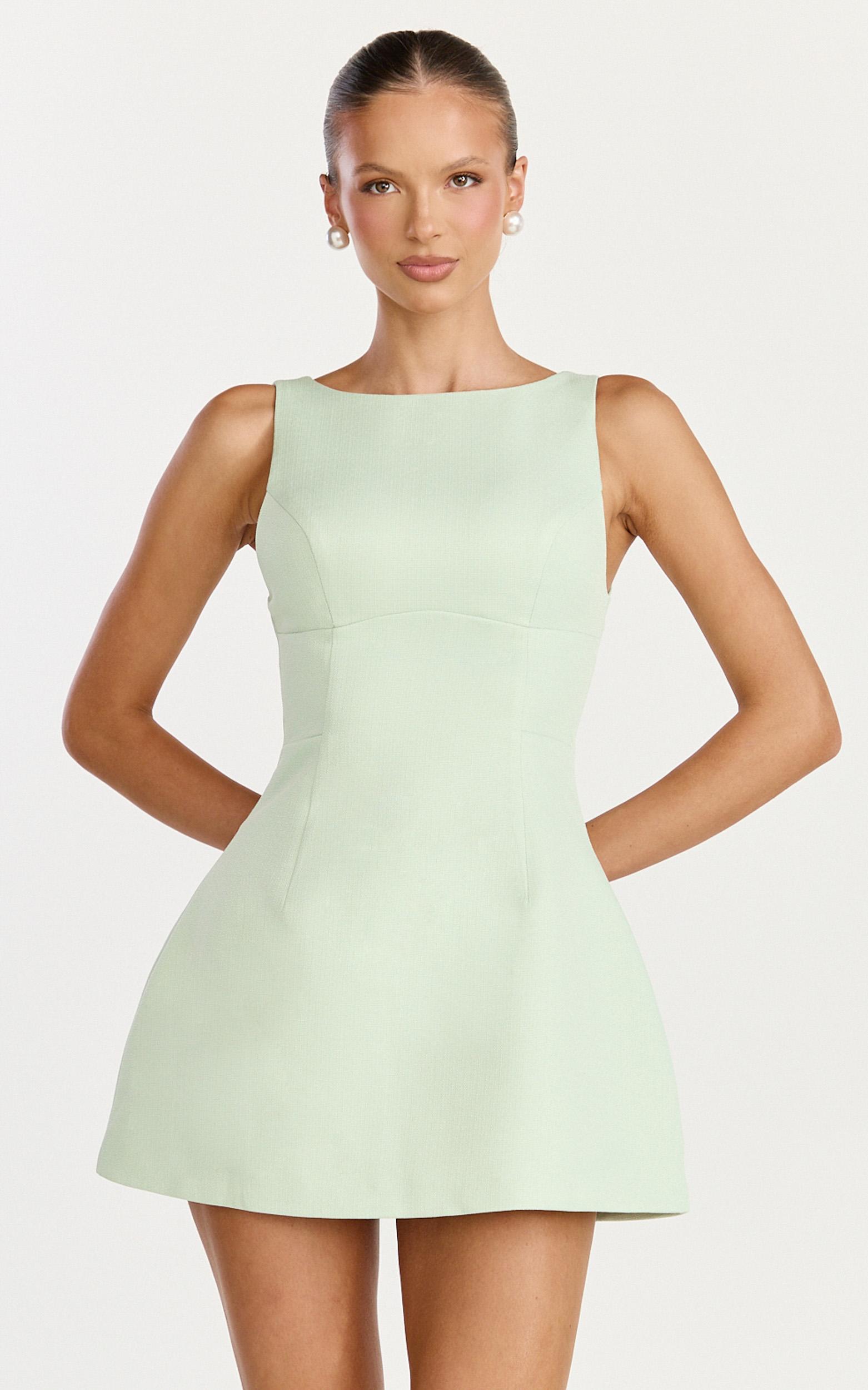 raquelle mini dress - boucle boat neck v back fit and flare dress in pistachio