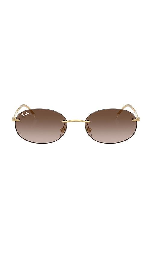 ray-ban oval sunglasses in metallic gold.