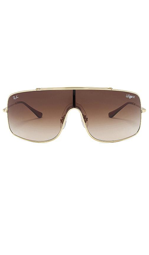 ray-ban wings iii sunglasses in metallic gold.