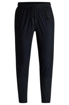 regular-fit tracksuit bottoms with quick-dry performance- black men's jogging pants
