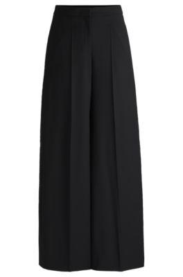 relaxed-fit trousers in wool- black women's formal pants