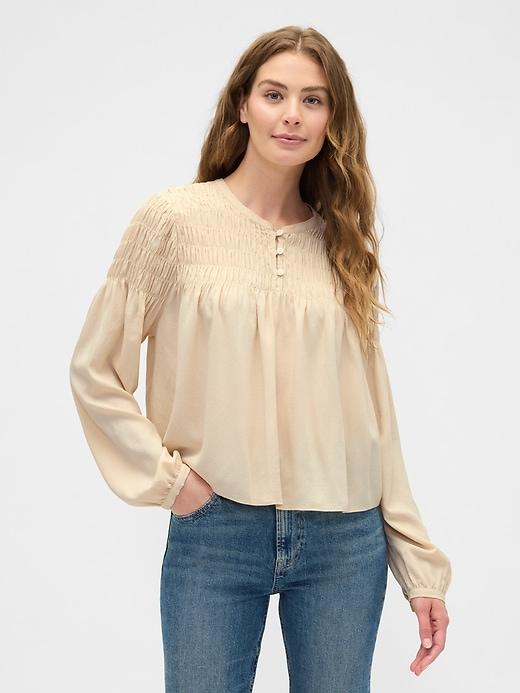 relaxed smocked balloon-sleeve top