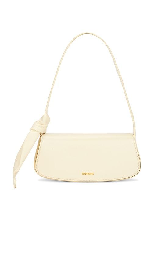 rotate leather knot strap bag in cream.