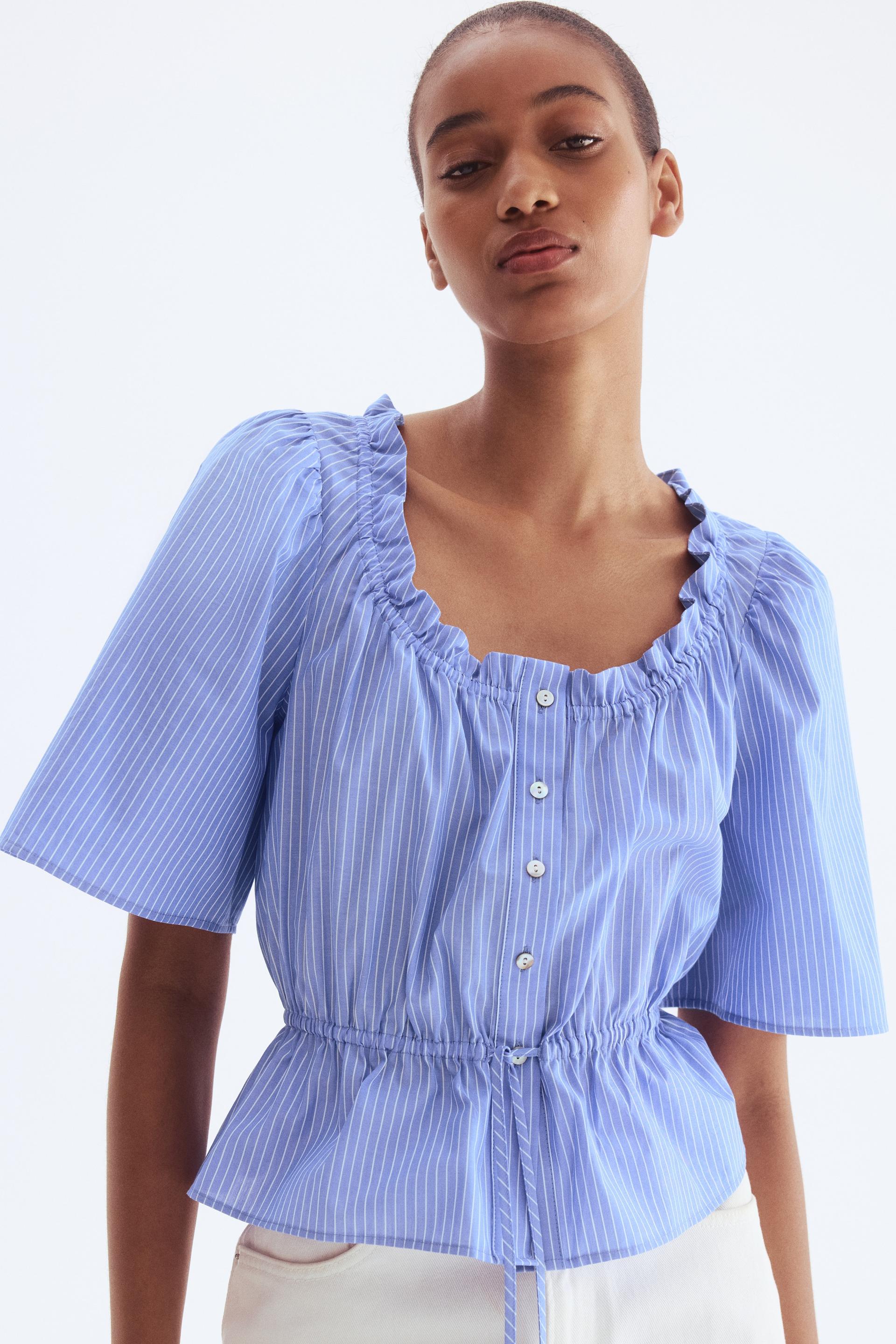 ruffle-trimmed cotton blouse