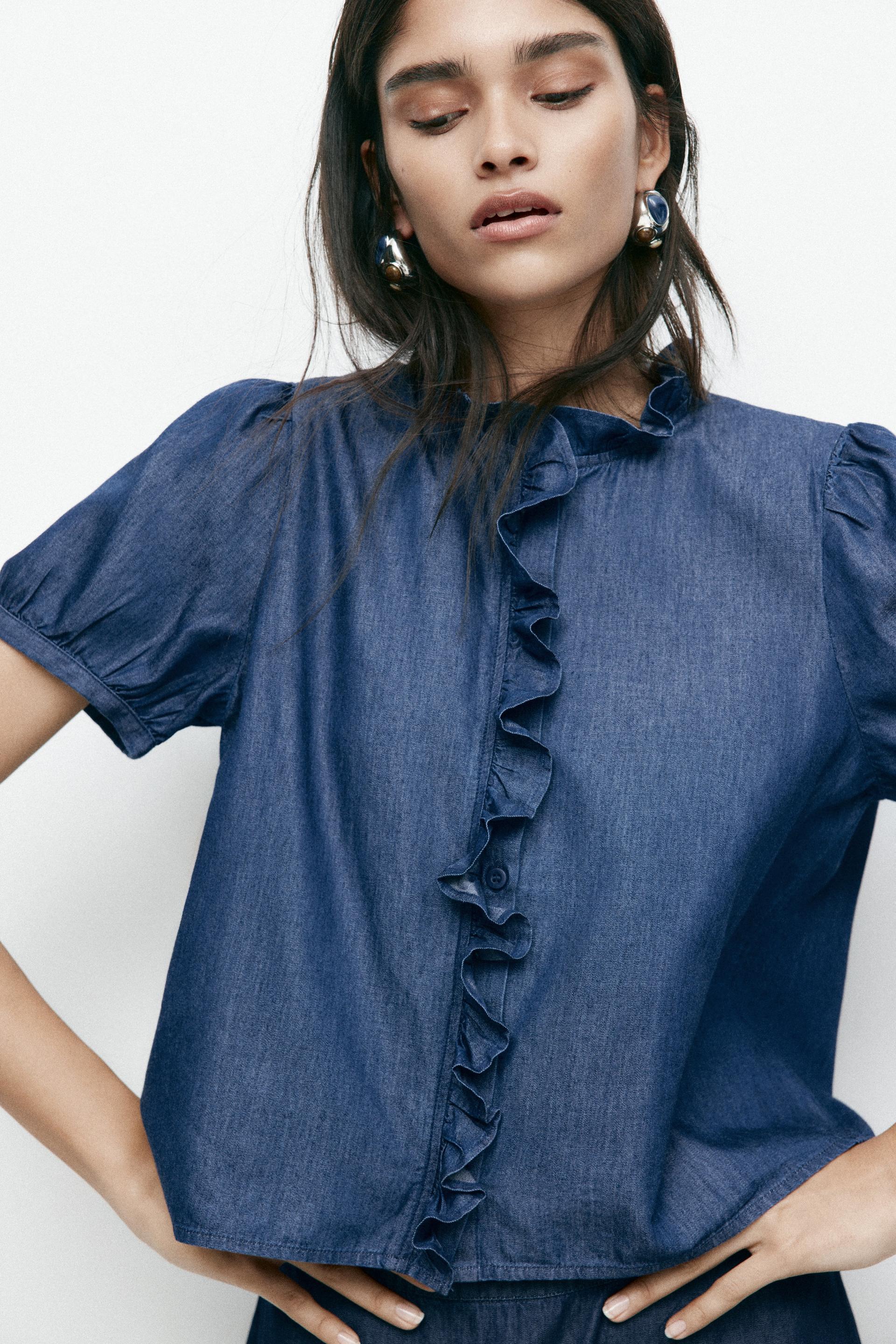 ruffle-trimmed denim blouse